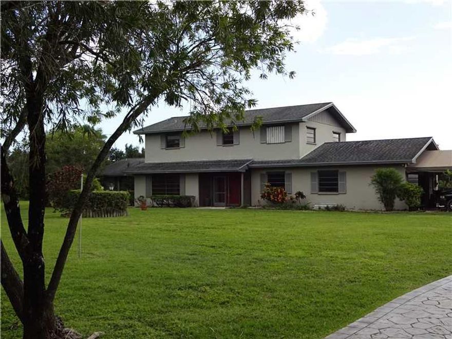 A must see!  This 5 BR/4 BA house sits on 4.62 acres of land. Double wooden front doors. Sliding glass doors off the family room lead to the pool. The kitchen as eat-at counter and a pass through to the pool.  Breezeway to the pool house which has living/ great room along with a wet bar and 1 BR and 1 BA. 2 car garage with automatic garage door opener. Pool/spa is covered with a paved floor.   Pole barn has concrete slab.  Separate in-laws quarters.