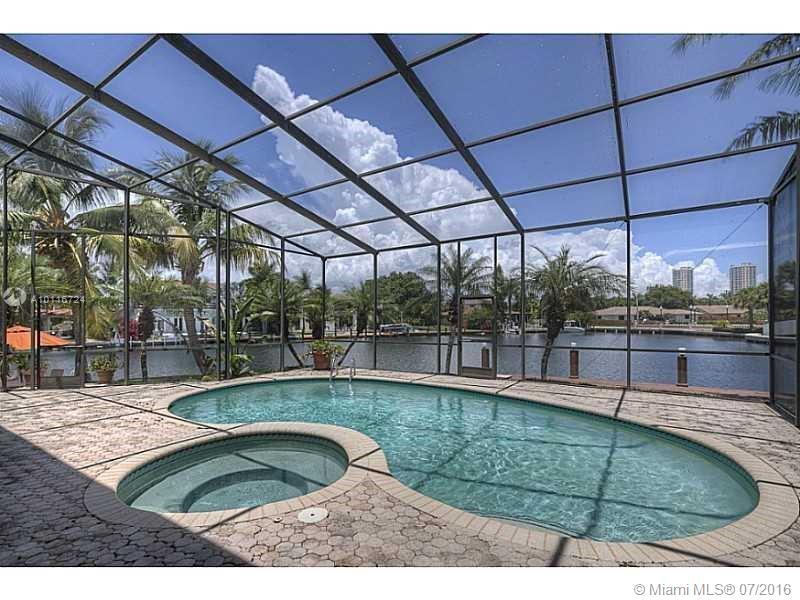 WATERFRONT OASIS home in the Prestigious and exclusive Golden Isles! Huge corner lot with water surrounding the home on two sides,.. Impeccable views and room for two boats with no fixed bridges. Outstanding updates, marble floors, pool and jacuzzi. This peaceful guard-gated community is walking distance to the beach, Gulfstream shopping center, and the Diplomat golf course and minutes driving distance to Aventura mall.