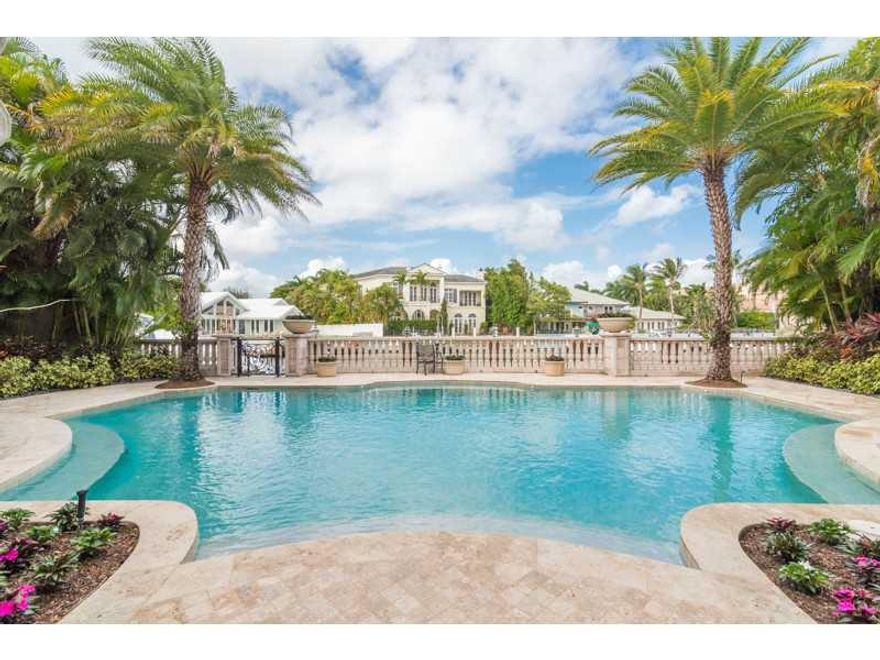 This 10,000+ SqFt, 6 bedroom, 7.4 bathroom estate boasts luxe finishes throughout and 65 feet of deepwater frontage. Located within The Sanctuary, one of the most secure and exclusive communities in the nation according to Forbes, this impressive home off ers privacy and resort style living. Whether you're working from the rich wood paneled executive office, socializing in the expansive family room, or resting in your palatial master suite  647 Osprey Point Circle embodies livable luxury.