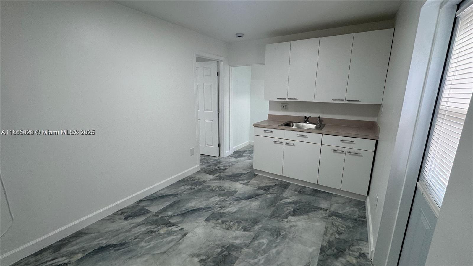 Electricity, water, and sewer included in rent. Spacious and lovely 1-bedroom, 1-bath ground floor unit with a
bright, welcoming interior. Includes 2 parking spaces and on-site coin laundry. Conveniently located on NW 27th
Ave with quick access to SR-826 and I-95. Just 20 minutes to Miami International Airport, 10 minutes to Hialeah
Hospital, and close to Miami Dade College, Wynwood, Downtown, and Brickell. No HOA—fast approval! Move in
with just first month and one security deposit. Easy to show