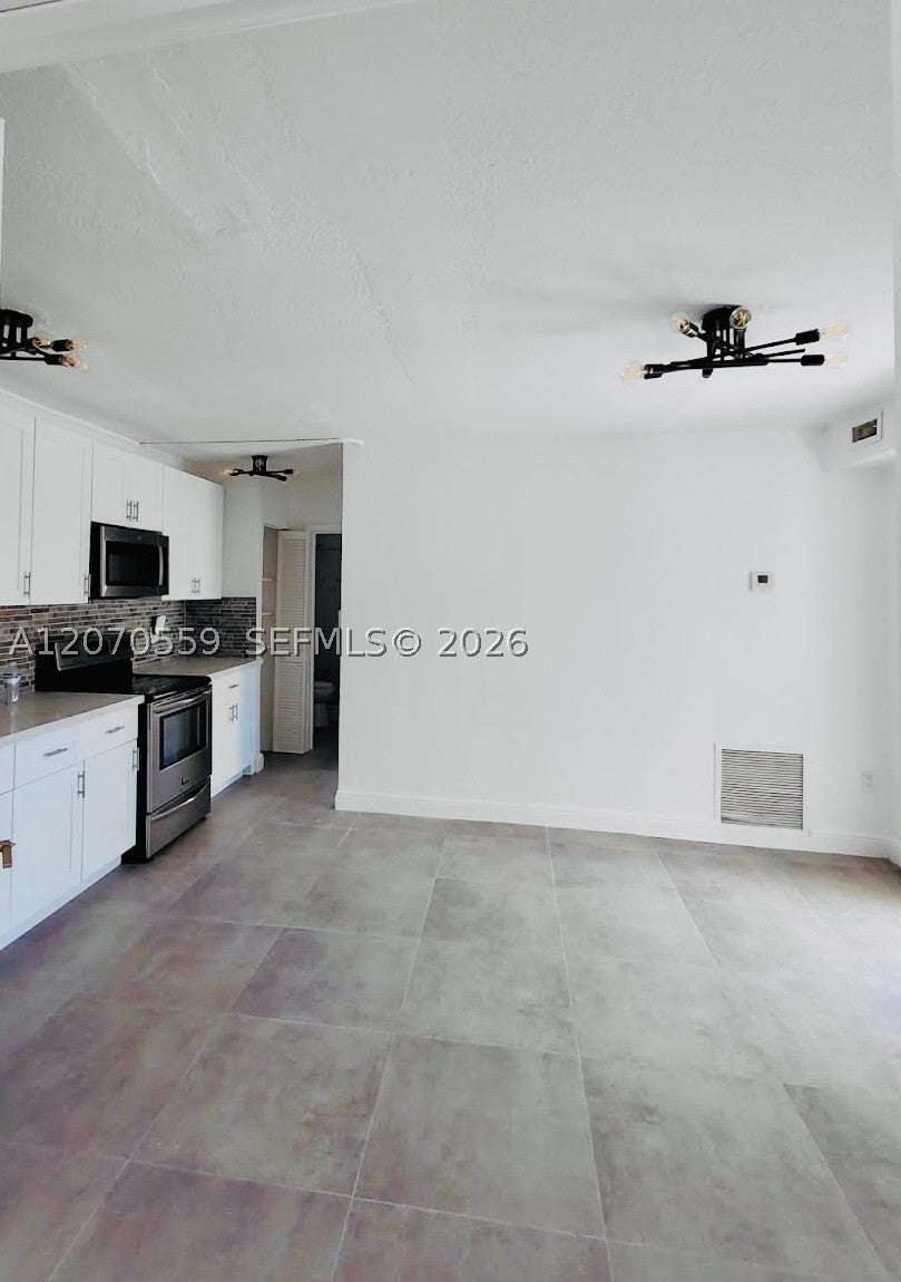 Photo of 308 NW 2nd Ave #S, Deerfield Beach, FL 33441 (MLS # A12070559)