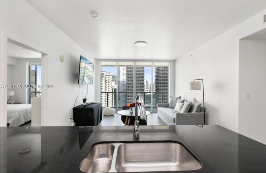 Experience elevated living in the heart of Brickell, Miami with this impeccably renovated two-bedroom, two-bathroom luxury residence. Designed with sophistication and comfort in mind, this stunning apartment features elegant porcelain tile flooring throughout, creating a seamless and modern aesthetic.
The gourmet kitchen is fully equipped with brand-new stainless steel appliances, sleek cabinetry, and refined finishes—perfect for both everyday living and entertaining. The spacious layout offers abundant natural light, while both bedrooms provide a serene retreat with beautifully updated bathrooms.
Additional highlights include a private in-unit washer and dryer, as well as one assigned parking space in the secure garage.
Residents enjoy access to an array of exclusive building amenities, including a state-of-the-art fitness center, resort-style swimming pool, and premium lifestyle services designed to complement a luxurious urban experience.
Ideally located in the vibrant Brickell district, this residence offers the perfect blend of elegance, convenience, and modern city living.