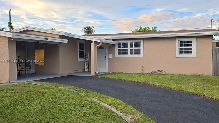 ***New Listing Alert!*** The perfect gift of homeownership just in time for the holidays. This spacious 4-bedroom property has all the right bones and incredible potential, ideal for multigenerational living in the heart of Broward County. Freshly painted with new flooring, a covered carport, ample parking, and impact windows and doors that qualify for mitigation and 4-point insurance credits, helping to keep insurance costs more affordable. Resurfaced driveway and carport.  Centrally located near highways, shopping, and places of worship, this home is ready to become your own tropical paradise, with room to grow, offering low taxes and a motivated seller.  Show and sell!