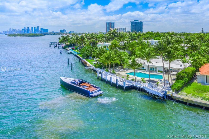 Attention boaters! Take in the views from this tranquil Key West style home on double gated Belle Meade Island w/only approx. 60 homes. With a little over 116 ft of wide open Bay water frontage, a 48.5 ft dock & boat lift, towering Palm trees, a resort-style pool, this back yard oasis is even better than vacation! This easy living, 1-story home on a pie-shaped 16,736 sq. ft. lot features a serene front wraparound porch, open floor plan, impact windows, 1 car garage, portable generator & a Florida room with a bar w/dramatic views overlooking the Bay. Move right into this rarely available immaculate home. Opportunity awaits to expand the current home or build a custom home on this perfect picturesque waterfront lot. Belle Meade Island is located in Miami's trendy Upper East Side.
