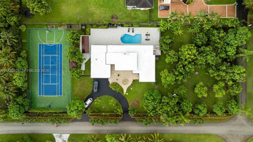 Welcome to your private Miami oasis! This stunning single-family home sits on a 1-acre corner lot, offering 4 bedrooms, 3 full baths, and an inviting updated pool. Enjoy a multi-sport court for tennis, pickleball, and basketball, plus mature fruit trees, a tranquil fountain, and full fencing for privacy. Inside, bright open spaces feature a cozy fireplace and a kitchen with stainless steel appliances. A 2 car garage plus space in the yard to park your RV or boat adds versatility. With space to build a guest house, this home offers immediate comfort and future potential. Located minutes from Dadeland, Baptist Hospital, South Miami Hospital, and major expressways, this is resort-style living in a prime location.