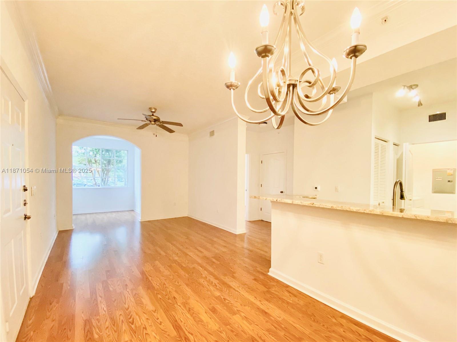 Great location for this UPGRADED 1/1 first floor condo!! This 704 sqft condo offers a cozy experience with laminate wood floor, lots of granite countertop and stainless steel appliances, open kitchen concept and crown molding. Separate laundry room with full size washer and dryer. Condo is freshly painted in neutral color. Enjoy Fiore's amenities that include a resort-style swimming pool, gym, putting green, kids playground, Club house, TV room, cyber cafe & conference room, media center, car wash center, BBQ area, volleyball sand court. Few minutes from the beach and all that Palm Beach gardens have to offer !!