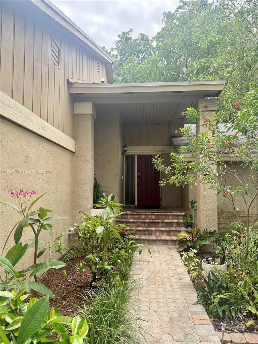 Welcome to this beautifully maintained home in the sought after Lakes of the Meadows community! Features a desirable split floor plan with the primary suite on the first floor with easy maintenance all tile flooring. Upstairs boasts engineered hardwood floors, 2 generously sized bedrooms and a loft living room w/impact windows, perfect for an office or guest space. Home is enhanced by an 8 y/o roof and AC for peace of mind. Step outside to your tropical oasis backyard w/lush landscaping and a cozy nook ideal for relaxing or entertaining. Resort style amenities, including clubhouse, pools, gym, sauna, basketball, racquetball, baseball, tennis, and more – all for a low HOA of just $141/month. Top-rated community school, Jane S. Roberts K-8. A fantastic place to call home and raise a family!