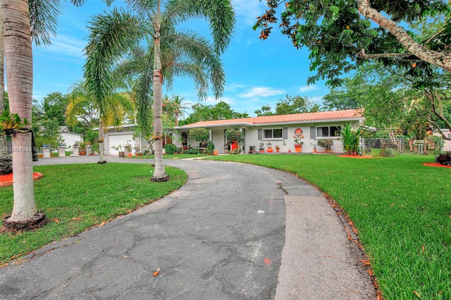 This beautifully maintained 3/2 South Florida residence blends timeless charm with modern upgrades. The exterior features a new garage roof (1 yr old), original Spanish barrel tile roofing, & lush tropical gardens with fruit trees. Inside, enjoy a custom kitchen (granite counters, glass tile backsplash, mahogany cabinetry), marble baths, & original Terrazzo flooring. Recent upgrades include a new A/C system, spray foam insulation, & impact windows/doors. The outdoor oasis offers a screened circular porch with broken stone flooring & a kidney-shaped pool with concrete decking, salt chlorinator, & gas heater. Perfectly located near I-95, Turnpike, 595, Sawgrass Mills, top restaurants, hospitals, & beaches—this home delivers comfort, style, & convenience in a prime location.