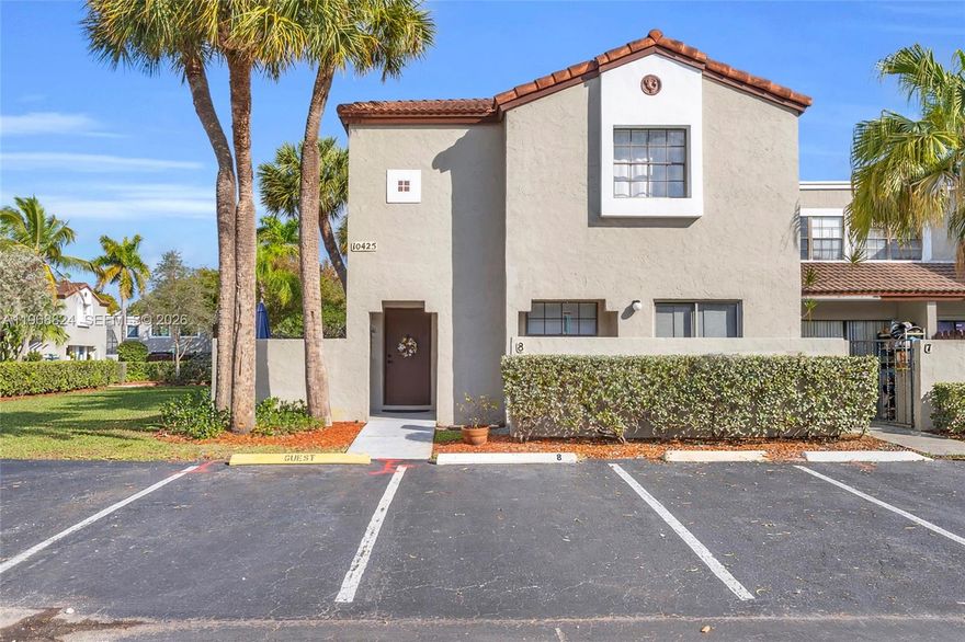 Welcome to Palm Point at Hammocks. From the moment you step inside, you're already home. The garden frames the home beautifully, you can enjoy the view while you are cooking in the modern updated kitchen with new appliances, 2025, and the customized sink. The Living Dinning area blends comfort and functionality into an open space designed for relaxation and connection. Laundry and half Bathroom are located on the first floor. This amazing corner unit has tile throughout on the first and second floor.  Upstairs layouts include 2 Primary Bedrooms with 2 full bathrooms and walk- in closets. Property has 1 assigned parking space in front and plenty of guests parking. HOA Includes Roof repairs and replace and Exterior painting, landscape, access to Palm Point Club House, unit is located just a few steps to the Club House and the entrance to the Lake, and pool and also Hammocks Amenities, with 2 pool and gym, a Lagoon with sandy beaches, surrounded by a biking and jogging 4 miles trail, Hammocks Parks, Tennis, Soccer, Baseball Pickleball courts, A+ schools and many activities. All types of loans are welcome. Low Down Payment, Low maintenance.