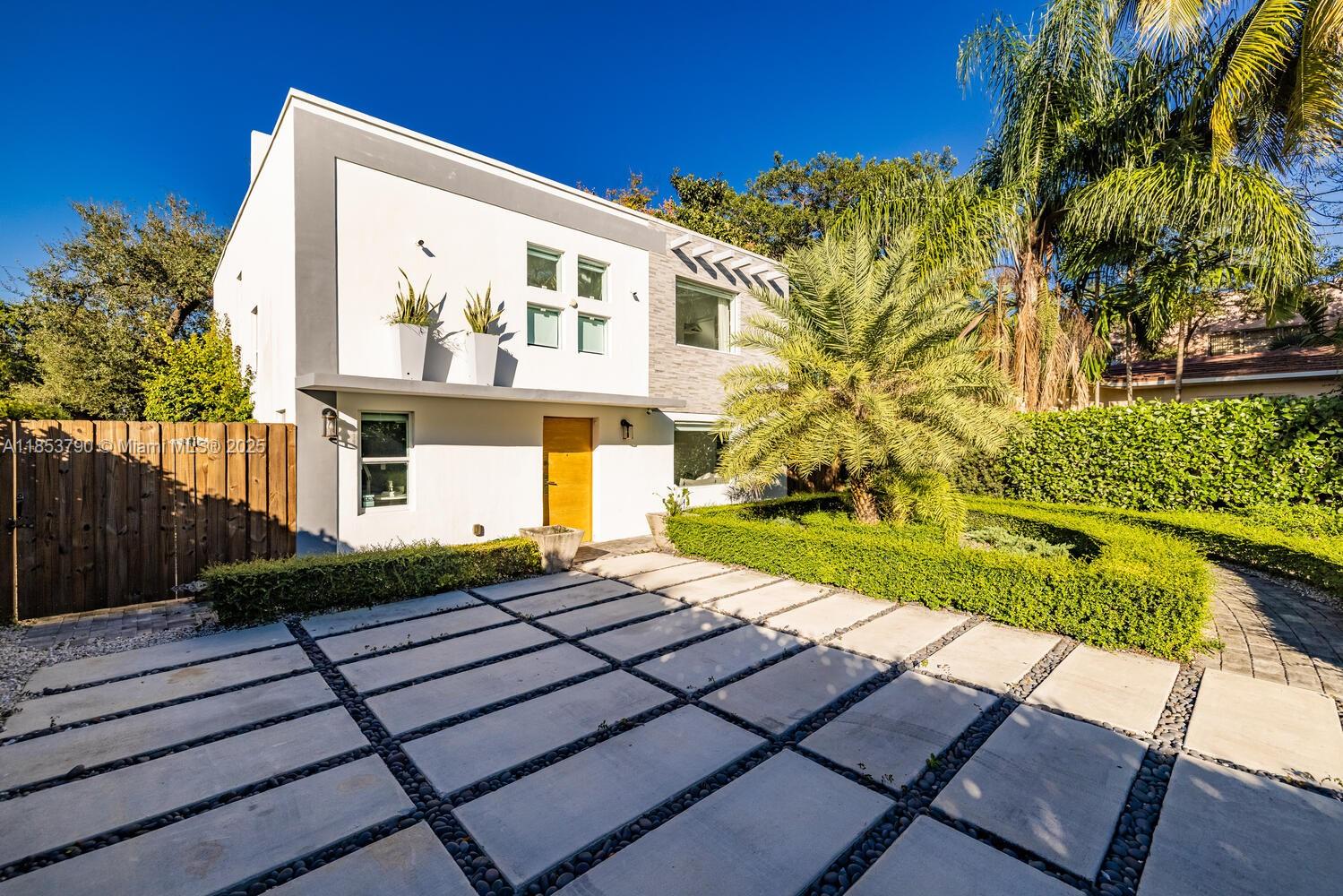 Welcome to this spacious 4-bedroom, 3-bathroom home located on one of the most desirable streets in El Portal. Set behind lush privacy hedges, this home features a sleek modern facade, minimalist landscaping, and oversized driveway. The layout includes a first-floor bedroom with a full bathroom—perfect for guests or a home office. Upstairs, the primary suite features a generous walk-in closet and a private en suite bath. This home is quipped with high-impact windows and located in a non-flood zone. The beautifully landscaped backyard offers ample space to build your dream pool. El Portal is one of Miami’s most sought-after neighborhoods, just minutes from the Design District and Midtown. With short-term rentals permitted, this property is also an excellent opportunity for investors.