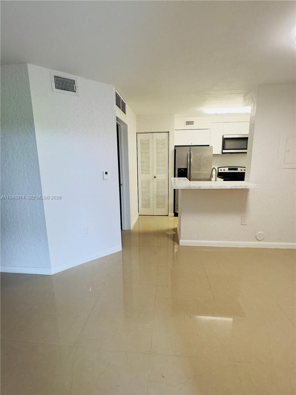 Photo of 2851 N Oakland Forest Dr #110, Oakland Park, FL 33309 (MLS # A11948914)