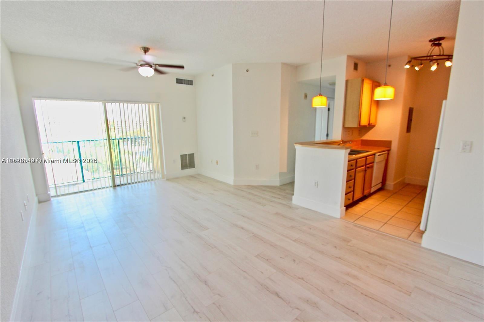 Available August 25, 2025. Bright and airy top-floor 2-bedroom, 1-bath unit with west-facing sunset views and luxury laminate flooring throughout. Features include in-unit washer/dryer and one assigned garage parking space. Centrally located near UM, Larkin Hospital, Coral Gables, Coconut Grove, and Downtown South Miami, with easy access to Metrorail, bus lines, and major highways. Enjoy building amenities like a pool, fitness center, and 24-hour security. Tenant occupied—advance notice required for showings.