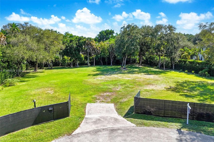 Build your dream estate on this rare, nearly one-acre homesite in coveted Pinecrest—renowned for top-rated schools, parks, and a true neighborhood feel. Nestled on a quiet cul-de-sac, the property offers exceptional privacy and an ideal canvas to bring your vision to life with a commanding street presence. A mature podocarpus hedge frames the lot with lush greenery for instant curb appeal. Prime location minutes to elite schools, shopping, and dining—ample room for a grand residence, pool, and outdoor living. An outstanding opportunity for end users and builders.