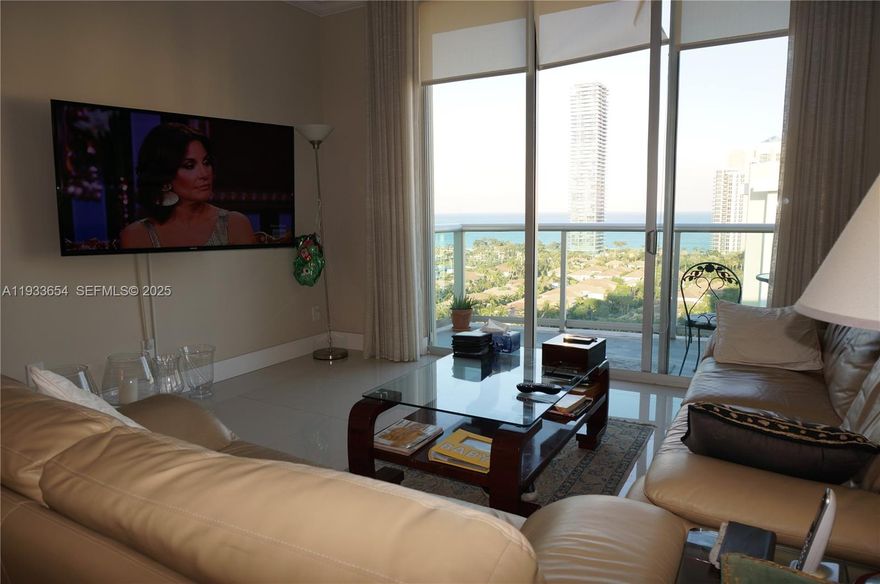 This gorgeous Ocean View Penthouse. This is a one-of-a-kind Penthouse with 12' ceilings.Amazing 2beds/2baths totaling 1549 sqft. Cross the street to the Beach! Best location in Sunny Isles. Move in ready. Unit offers open kitchen, stainless steel appliances, tile floors, large bedrooms, huge walk in closets (one has the size of an office space) private balcony. Well maintained and managed building, recently renovated common areas, building exterior & facilities. Amenities include pool, tennis court, BBQ area, state of the art fitness center, 24-hour security and valet. Association fee includes water, cable and internet. Perfect location to beach, malls, airports, and restaurants. A+ schools. Easy to show.