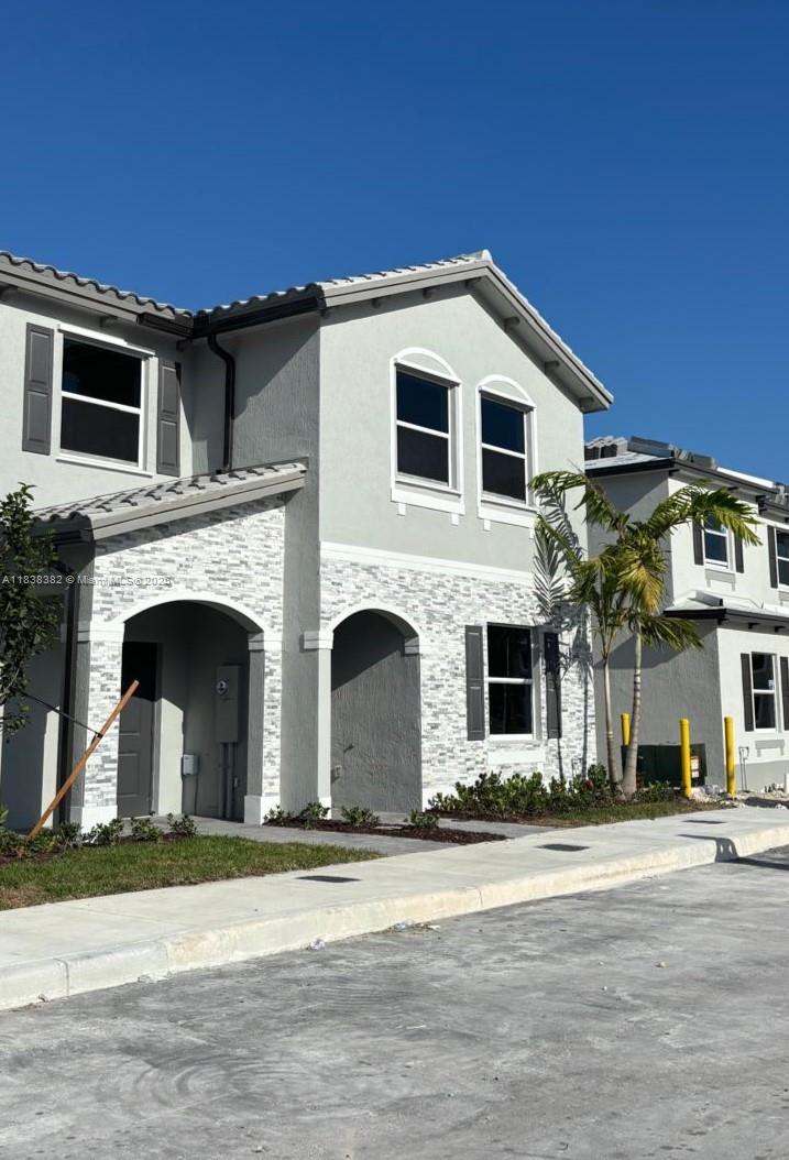 Brand-new, never-lived-in corner townhome in the desirable Le Jardine community by Lennar! This 4-bedroom, 3-bathroom home offers a functional layout with one bedroom and one full bathroom on the first floor—perfect for guests or multi-generational living. Enjoy a modern open-concept kitchen with upgraded finishes, ceramic tile flooring on the first level, and brand-new carpet upstairs. Impact-resistant windows and doors provide added security and energy efficiency. The private, fenced-in backyard patio is ideal for relaxing or entertaining. Laundry area with washer and dryer located on the second floor. Located very closer to US-1, the Turnpike, and right next to the brand-new Publix shopping center. Schedule your private showing today!