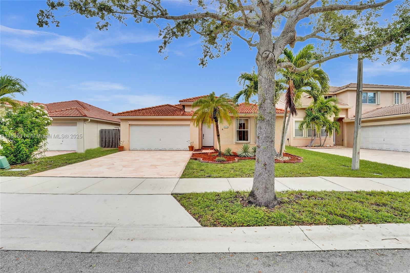 Come check out this cozy, move in ready 3-bedroom/2.5-bathroom home. This lovely and well-maintained home is located in a gated community of Poinciana Parc in Shenandoah. Enjoy lots of natural light, fresh paint, new carpet and high ceilings. Large primary bedroom with private bathroom and walk in closet. Have fun hosting friends and family with the privacy of a fenced yard and a spacious backyard with a patio. Property also includes accordion shutters, new water heater and roof (2020). Great schools and children's park close by. Easy highway access to I-595 and centrally located in Broward near other highways and the airport.