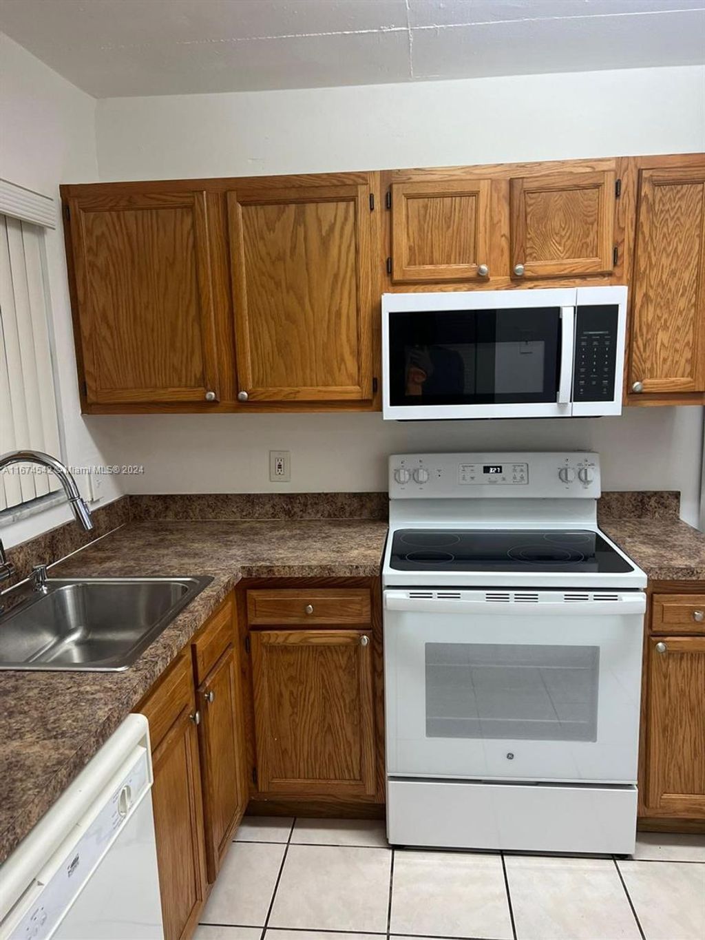 Photo of 1638 Embassy Dr #312, West Palm Beach, FL 33401 (MLS # A11674542)