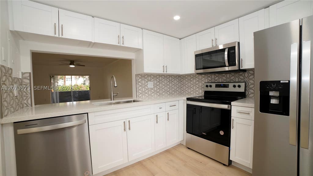 Photo of 4291 NW 9th Ave #101, Deerfield Beach, FL 33064 (MLS # A12073573)