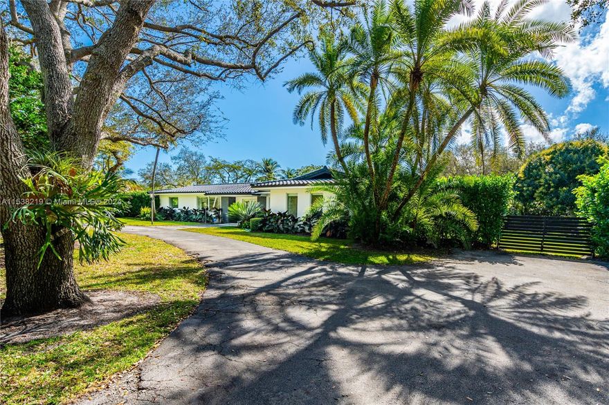 Situated on a quiet street, the house boasts an open-floor plan, spacious living, and dining area. Floor-to-ceiling impact glass doors with breathtaking views of a fully tiled trough out pool, creating a seamless indoor-outdoor living experience. The expansive patio and vast backyard provide an ideal setting for hosting gatherings and enjoying outdoor activities with a unique Argentinian grill and dining area. The home features four bedrooms total. The master bedroom includes two walk-in closets and its ensuite bathroom. One bedroom/study with an accompanying bathroom located on the West side. The property has a two-car garage conveniently adapted as an additional expansive social area.