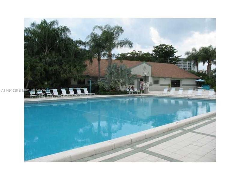Photo of 2230 N Cypress Bend Dr #403, Pompano Beach, FL 33069 (MLS # A11494830)