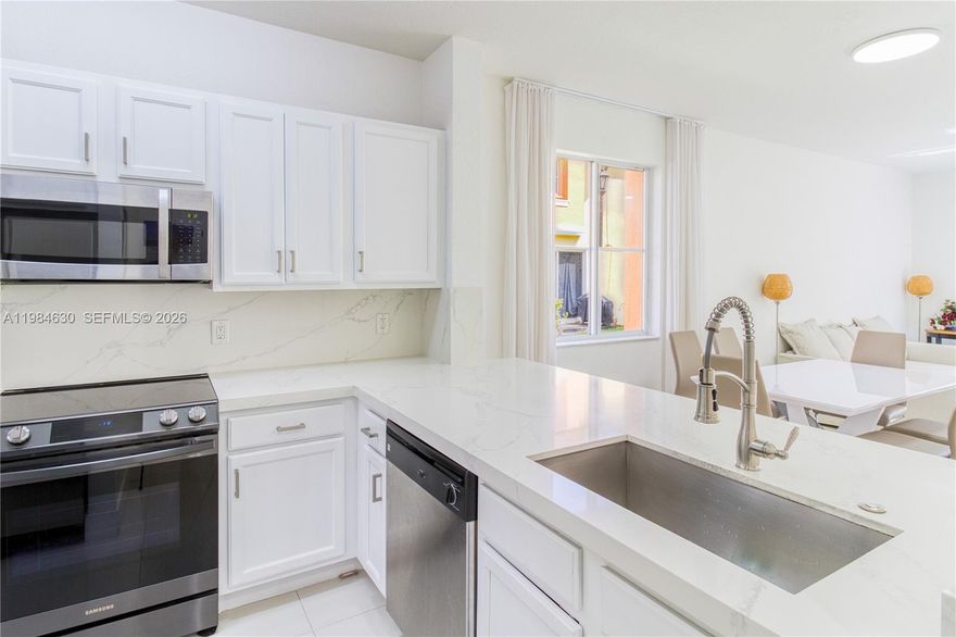 Fantastic value! Beautifully renovated corner townhome built in 2014 in the highly sought after gated community of the Village at Miramar. Inside, the home showcases thoughtful upgrades, including a modern open-concept kitchen, a new A/C system, and durable vinyl flooring throughout the upper level—making this move-in-ready residence a perfect blend of comfort and style. The family room walks out to the courtyard great for kids and furry friends to play. The corner unit location offers a more spacious feel compared to interior units. The surrounding area enhances the lifestyle appeal, with a wide variety of shopping centers, grocery stores, restaurants, and local dining spots just minutes away. The community features a great pool and playground to enjoy. FHA and VA welcome and Roof is included in HOA fee. Move quick on this one!