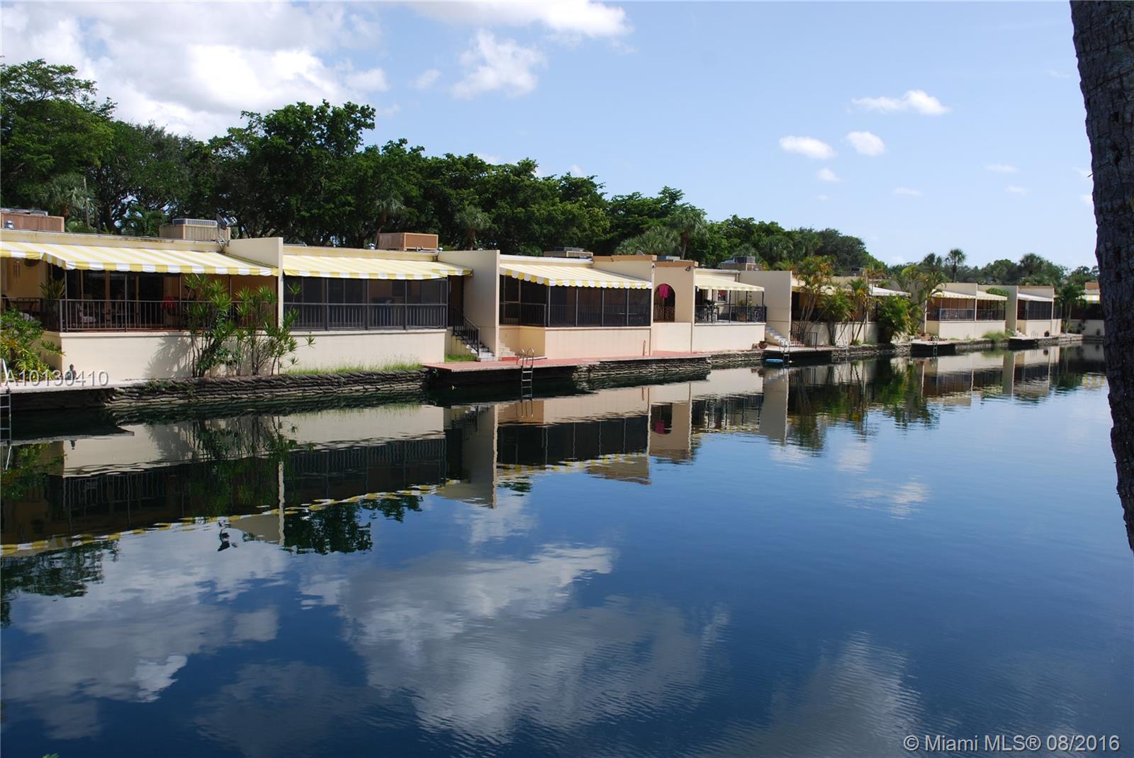 Beautiful lake view townhouse in Miami Lakes! Ideally situated close to Main Street, highways, shopping centers and other points of interest. This home features a remodeled kitchen, laundry room, stainless steel appliances, high impact windows, and patio! Needs a little TLC. A must see!