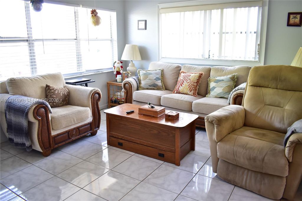 Photo of 9141 Sunrise Lakes Blvd #201, Sunrise, FL 33322 (MLS # A11931693)