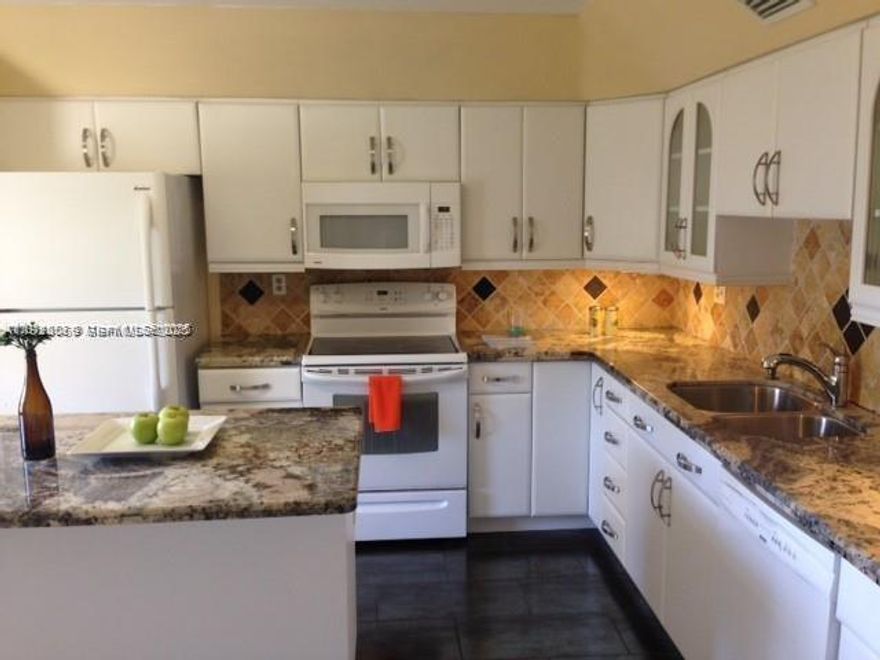 PRICE CORRECTION . Very beautiful resort style home. Lots of light and air. Large (1,770 sq.ft.) split plan 3 bed/2.5 bath. Completely remodeled kitchen with brand new S/S appliances. New tiles in kitchen, living room and primary bedroom. Large, screened patio overlooking a tropical garden. Gated entrance. Assigned parking (B29). Extra storage space on the same floor. Washer/dryer inside. Walk-in closets. One occupant must be 55+. Purchaser (no age limit) must have 710 credit score, $45,000 income,20% escrow when financing, 6 months maintenance deposit refundable after 18 months, no rent 1st year. Maintenance includes heated pool, gym, ballroom, library, cable, internet, water, 24-hour security, outdoor grill, insurance, car wash. NO special assessment. 40-year certification completed.