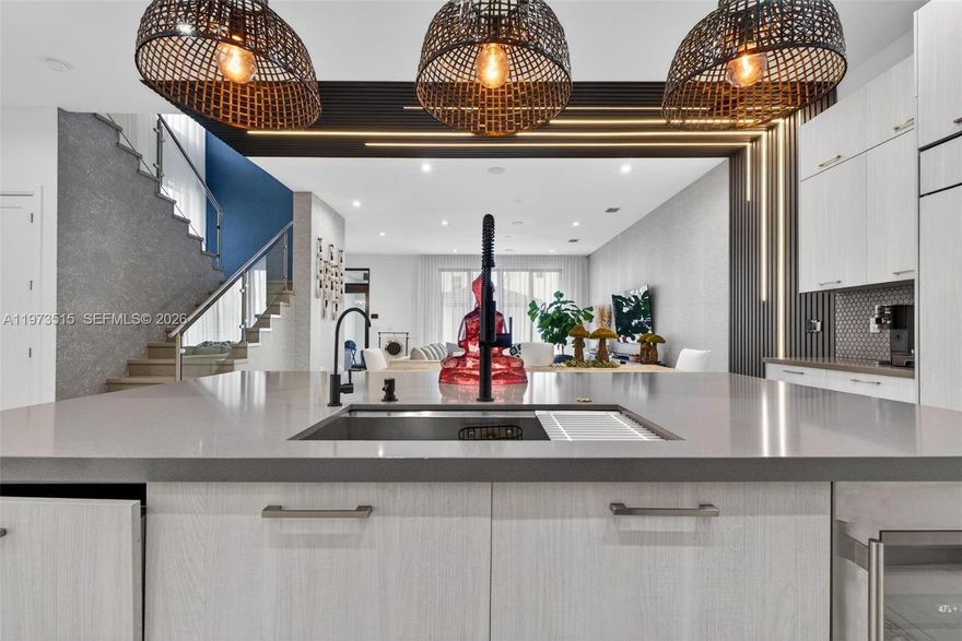 Experience elevated living in this fully upgraded luxury residence located in the highly sought-after Downtown Doral community. Thoughtfully designed with elegant porcelain flooring, custom wood accent walls, and sophisticated contemporary finishes, this home offers the perfect blend of style, comfort, and functionality.

The chef-inspired kitchen features premium appliances, modern cabinetry, and high-end countertops, creating an ideal space for both everyday living and entertaining. Security cameras throughout the house.

Step outside to your private resort-style backyard with a heated pool, designed for relaxation and outdoor enjoyment year-round. Additional premium features include a Tesla EV charger, whole-house water purification system, and integrated surround sound throughout the home.

A converted garage currently serves as a versatile game room and flex space, perfect for a home gym, media room, or lounge area. The extended driveway comfortably accommodates up to 5 vehicles.

Offered furnished or unfurnished, this move-in-ready residence presents a rare opportunity to own a truly turn-key luxury home in one of Doral’s premier neighborhoods.

Conveniently located just minutes from Downtown Doral’s top restaurants, shopping, parks, major highways, and highly rated schools.

Private showings by appointment.