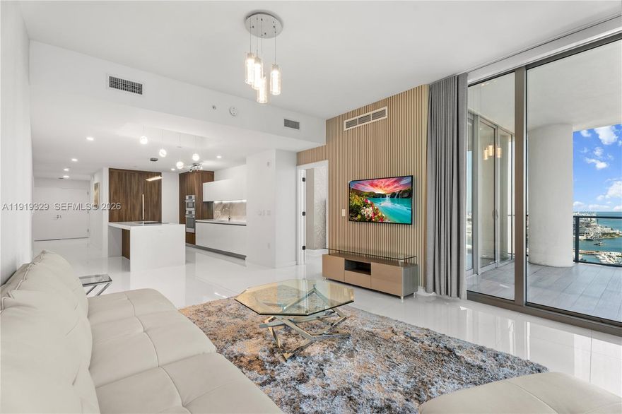 Welcome to the absolute best deal for a direct water view 3bed/4bath plus den with private foyer and elevator at Paramount Miami World Center. Features include: 10 ft high ceilings, Italian kitchen w/Sub Zero & Bosch appliances, Marble kitchen backsplash, white porcelain tile floors, floor to ceiling windows, custom drapery, wall paper, lighting and closets, large terrace space,, spacious master bedroom with water view, huge custom closet. spa like master bath with dual vanities with views of the water, spacious 2nd & third bedrooms with water views. Have access to resort like amenities including: 5 pools, gym, tennis, boxing as well as world class restaurants & shopping.