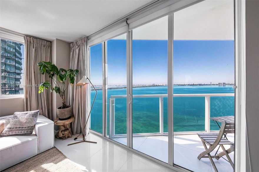 Stunning fully renovated corner residence at Onyx on the Bay with direct panoramic views of Biscayne Bay and the Miami skyline. This 2BD/2.5BA, 1,368 SF home showcases a thoughtfully curated design with elevated materials throughout, including a custom waterfall-edge kitchen island, premium cabinetry, designer fixtures, and marble spa-style bathrooms. Smart lighting, refined hardware, and cohesive contemporary finishes create a polished, modern aesthetic. Floor-to-ceiling windows fill the home with natural light, while two private balconies (175 SF total) offer sunrise and sunset over the water. Onyx on the Bay is a boutique luxury building with an infinity-edge pool, spa, sauna, steam room, fitness center, and 24/7 concierge. Edgewater continues to be one of Miami’s fastest-appreciating neighborhoods, surrounded by new luxury developments, waterfront parks, dining, and cultural districts. A fully refined, meticulously finished residence in a boutique bayfront building is a rare offering, combining strong resale value with wide appeal for both end-users and investors.