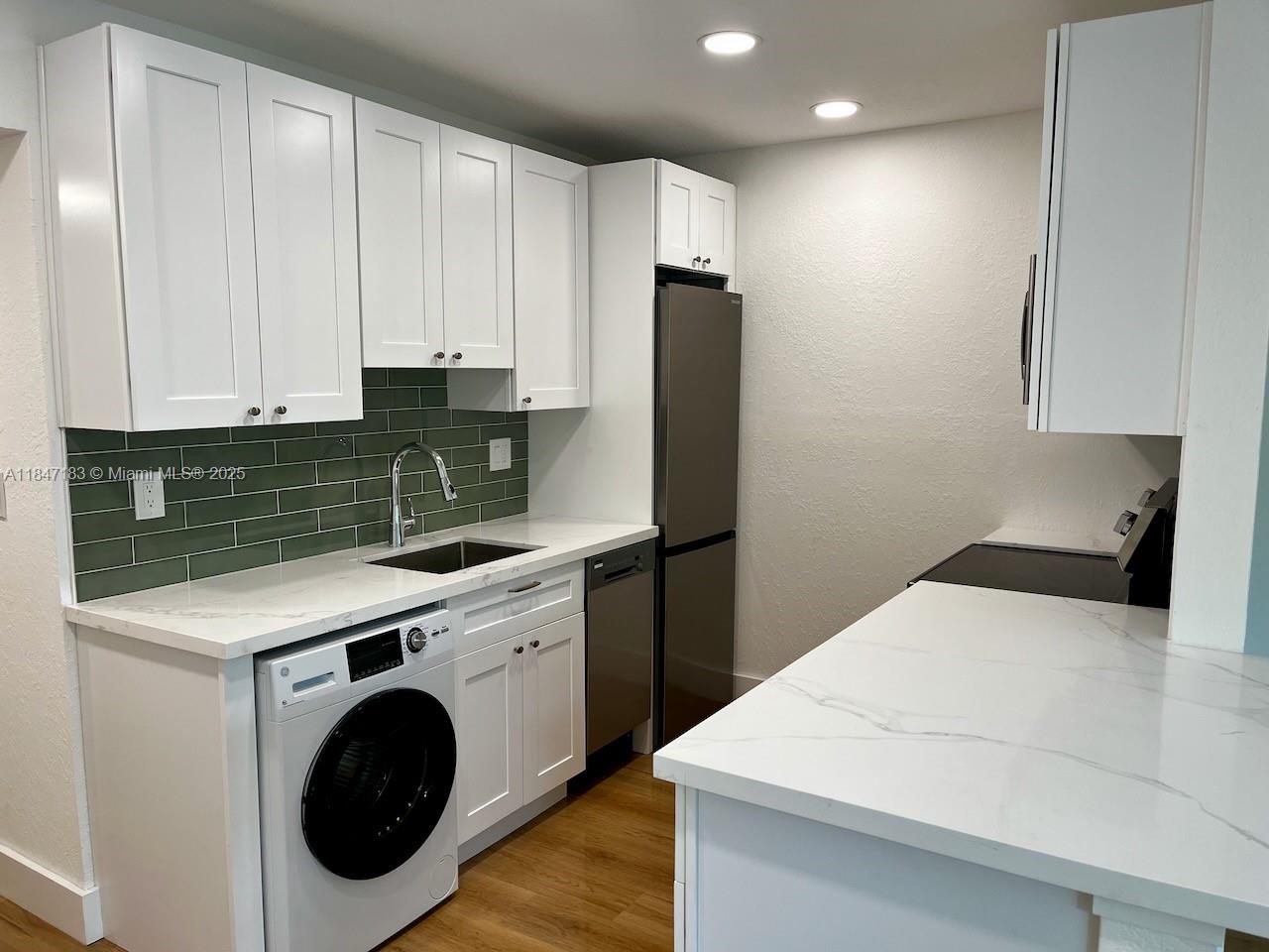 Live the ultimate South Beach lifestyle in this fully renovated corner-unit, offering both privacy and abundant natural light through expansive new windows with serene tree views. Featuring a modern-contemporary, open-concept kitchen with stainless steel appliances, custom cabinetry, and an in-unit washer/dryer, this home blends style with convenience. A short distance from Flamingo Park, Ocean Drive, and Whole Foods on Alton Road, it’s perfectly positioned to enjoy South Beach’s vibrant dining and nightlife while remaining a quiet retreat. Located in a boutique building with its own parking lot, this gem is ideal for those seeking a chic, low-maintenance rental in the heart of Miami Beach—schedule a tour today!