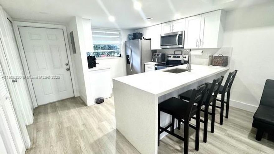 Tastefully Fully remodeled 2BD/1.5BA ground-floor residence in the heart of Kendall. Every detail has been upgraded modern kitchen with stainless steel appliances, elegant new floors, LED lighting, new custom window shades, and beautifully updated baths. Over $55K in renovations! Enjoy a bright, open layout. 1 assigned parking + Gues. Resort-style community with pools, Exercise room, tennis, Pickeball & basketball courts, clubhouse. Prime location near top schools, dining, shopping & Turnpike access. No pets.  Schedule your private showing today! Laundry facilities on each floor and Management office on site. Complex has completed 40 yr recertification! New Roof! as well as paint, hallway floors, lighting and new landscape. Move-in ready!