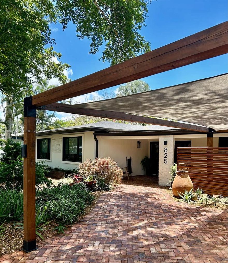 OPEN HOUSE MAY 9Th 11-2pm ***** NOT SHOWING BEFORE OPEN HOUSE UNLESS 48 HOURS NOTICE AND SELLER APPROVES showing with 48 hour notice before the open house .This charming ranch-style home, nestled among majestic trees on a serene street in Plantation, has undergone extensive renovations to offer a blend of modern comfort and timeless elegance. With a new shingle roof, newer diamond brite pool finish, and impact windows throughout, with the exception of 2 exits, it exudes durability and style. Inside, the remodeled kitchen and three full baths feature contemporary finishes, while travertine floors in the living areas and bathrooms, paired with hardwood floors in the bedrooms, add a touch of sophistication. A cozy wood-burning fireplace beckons gatherings in the living room, while the outdoor patio and pool area, adorned with rustic travertine floors and equipped with an outdoor pizza