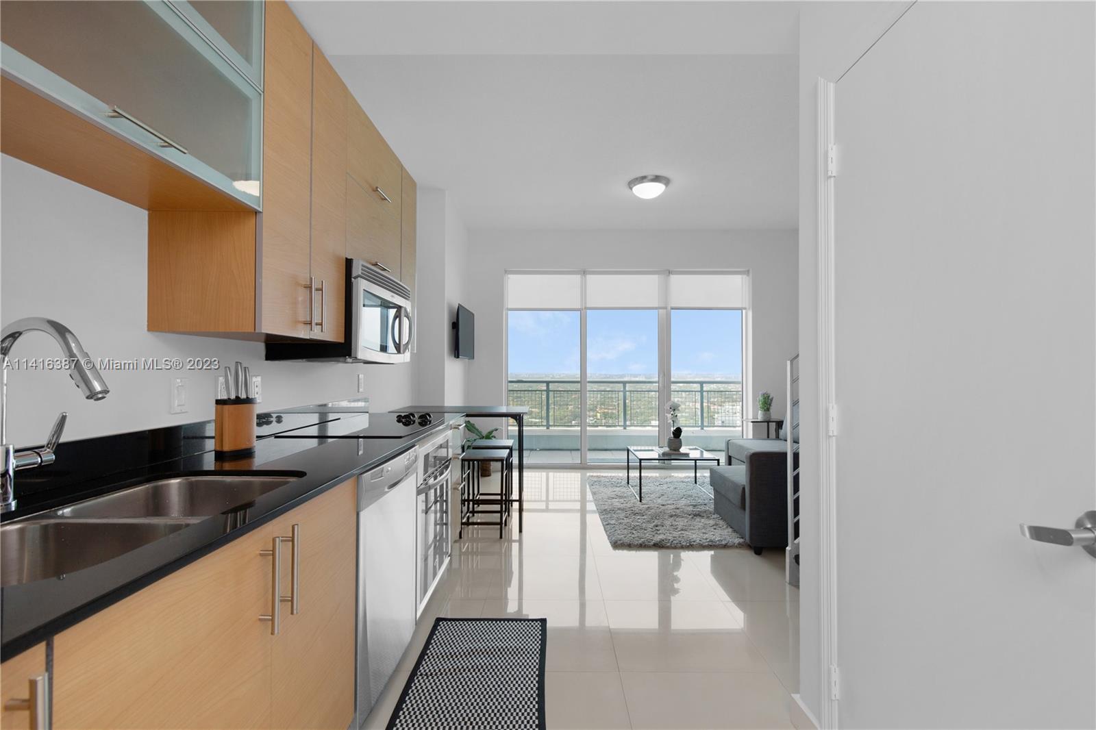 Spectacular 2 story loft, tall windows panoramic Miami skyline view. Enjoy two balconies with beautiful sunset views. Fully Furnished ready to move in (King sized bed shown is not included. There will be a more adequate Queen size bed included). Walking distance to Brickell City Center, Restaurants, Downtown financial center, metro mover. Tile floors. Includes Amenities such as infinity pool, state of the art fitness center, roof top garden, 24 hour concierge, valet, party room and more.