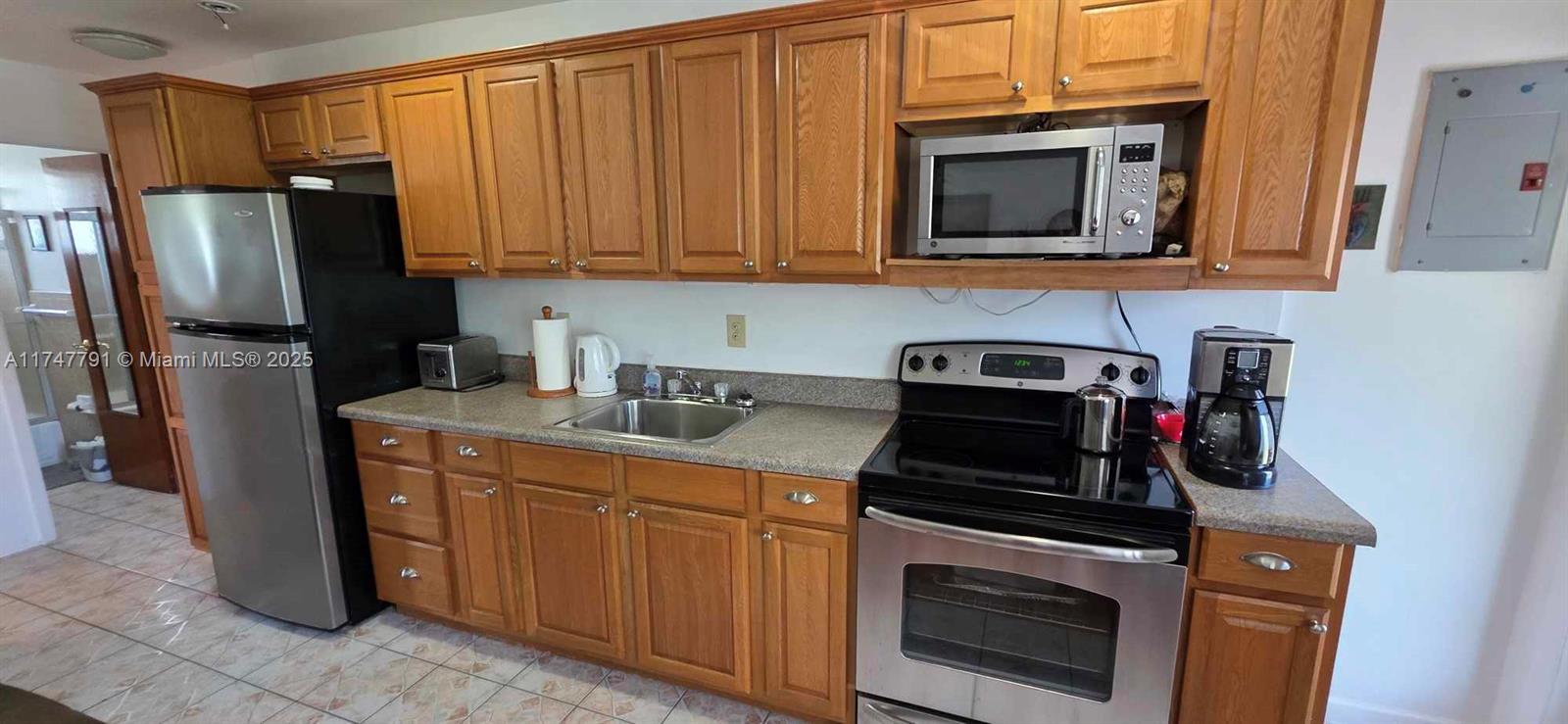 Charming 2-bedroom unit located on the second floor, offered fully furnished for your The kitchen is equipped with stainless steel appliances. This community features a gated fence and is situated in a prime location in the heart of Miami. The co-op owns the land, and the roof was redone in 2022. Excellent location close to everything. Don't miss this opportunity!