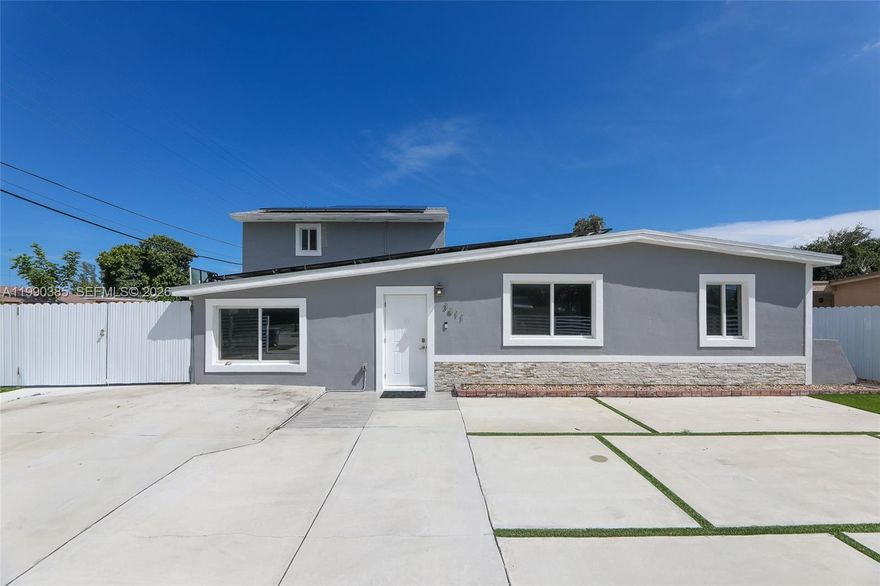 Beautiful spacious home. 6 bedrooms and 4 bath. Main House has 5 bedroom and 3 bath in the  and a 1/1 with its own separate entrance. 1/1 has a small mini kitchen. Heated pool and spa. Swim all year long. Pool/spa built 2 years ago. House has solar panel leased which will be transferred at closing. Enjoy a reduced electricity bill from day 1. Spacious masterbedroom with large balcony that overlooks pool. Pool lights up at night . Beautiful at night. Low outdoor maintenance. Concreted the entire exterior. Property is fully gated with a motorized motor and remote.
Front impact windows, roof 4 years old, and a brand new central AC.