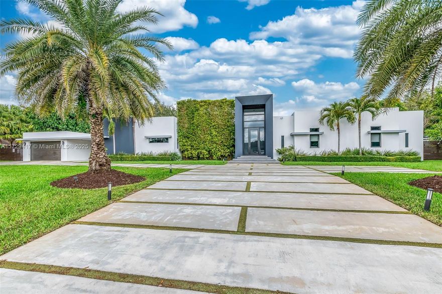 One story modern masterpiece with soaring ceilings throughout. Featuring 5 bedrooms and 5.5 bathrooms with 4275 sq ft of living area under a/c with 5600 Sq ft of construction on a builders acre. Located in a quiet cul-de -sac in the heart of The village of Palmetto Bay. Top of the line finishes with a Chef's kitchen that dazzles, with integrated high end appliances including Sub-Zero, Viking, Miele and a large walk in pantry. The master suite includes a spa like bathroom with a soaking tub and his/her water closets. The Suite has Impressive closet space blending luxury and functionality. Outside, enjoy your private oasis with a large terrace equipped with a summer kitchen. Oversized beach entrance pool with spa and water features. Modern Luxury blocks from parks and top rated schools..
