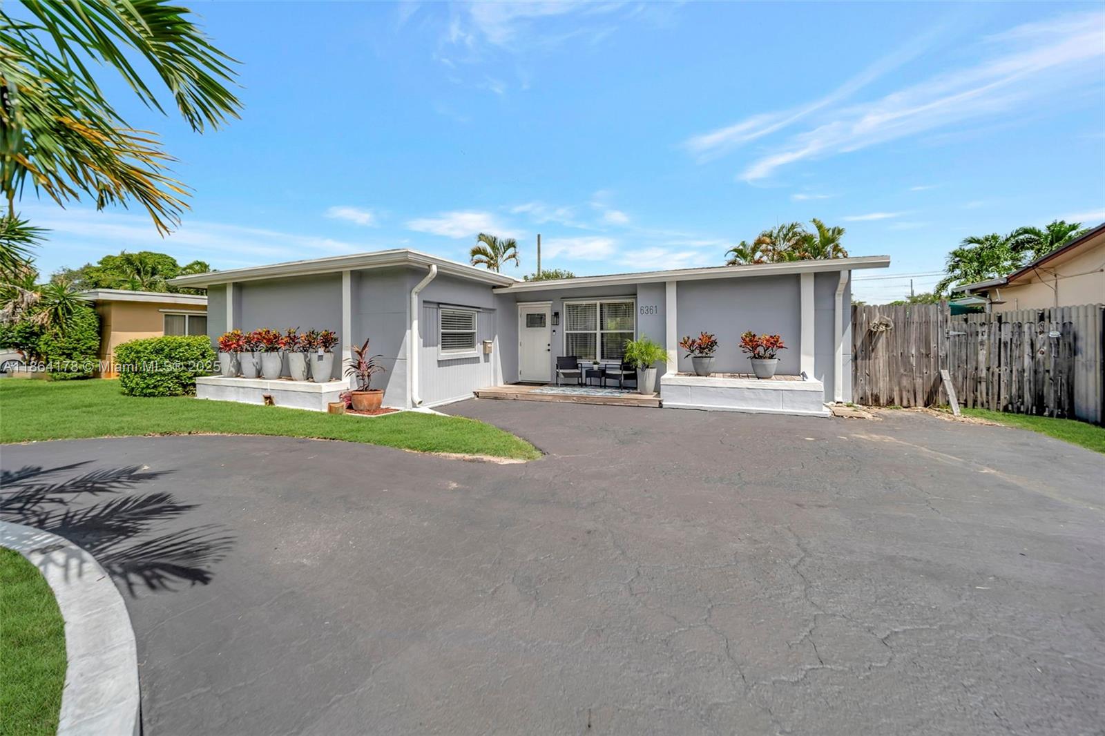 Charming 3-bed, 2-bath home in prime Hollywood, FL location! Featuring a newer kitchen and 2023 impact windows, this move-in ready home also has a fully fenced yard with the greenest grass in the neighborhood—perfect for pets or entertaining. Wood-look laminate and tile flooring throughout. Did I mention tons of parking space with the oversized circular driveway? Ideal for commuters with easy access to the Turnpike and major highways. Just minutes from shopping, dining, the iconic Hard Rock Hotel & Casino, and beautiful Hollywood beach. Don’t miss this opportunity to own a great home in a vibrant, convenient neighborhood!