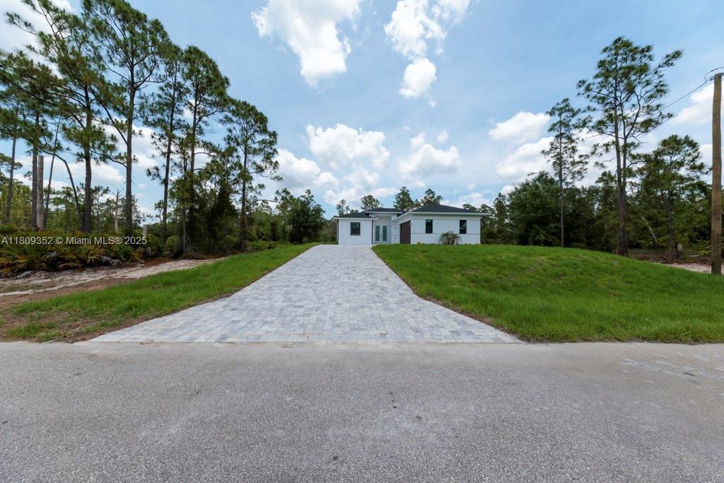 Property located in Lehigh Acres: 719 Almelia Street East Lehigh Acres, FL 33974
New Construction (2025) on a 1/4-acre lot