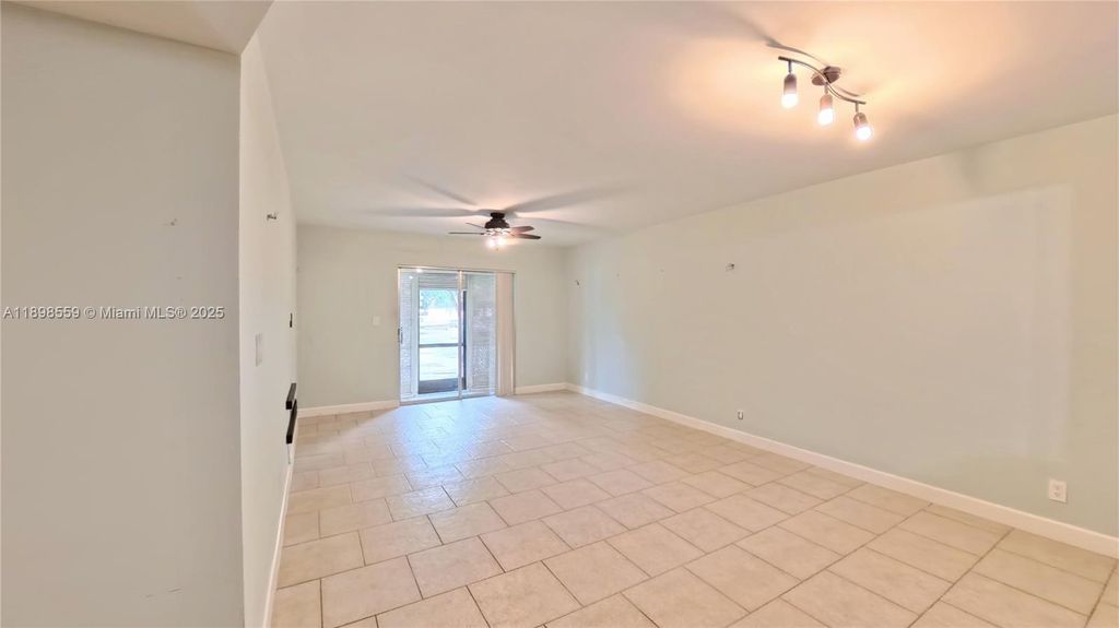 Photo of 4135 NW 88th Ave #103, Coral Springs, FL 33065 (MLS # A11898559)