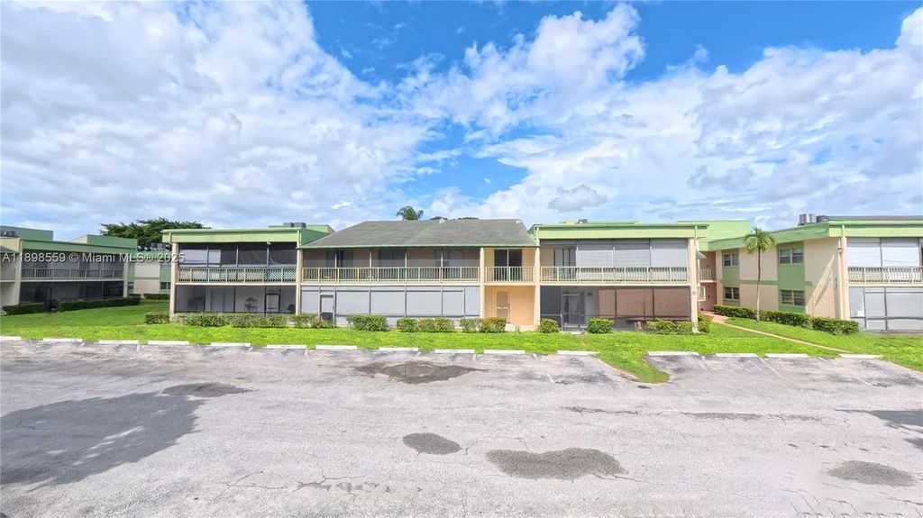 Photo of 4135 NW 88th Ave #103, Coral Springs, FL 33065 (MLS # A11898559)