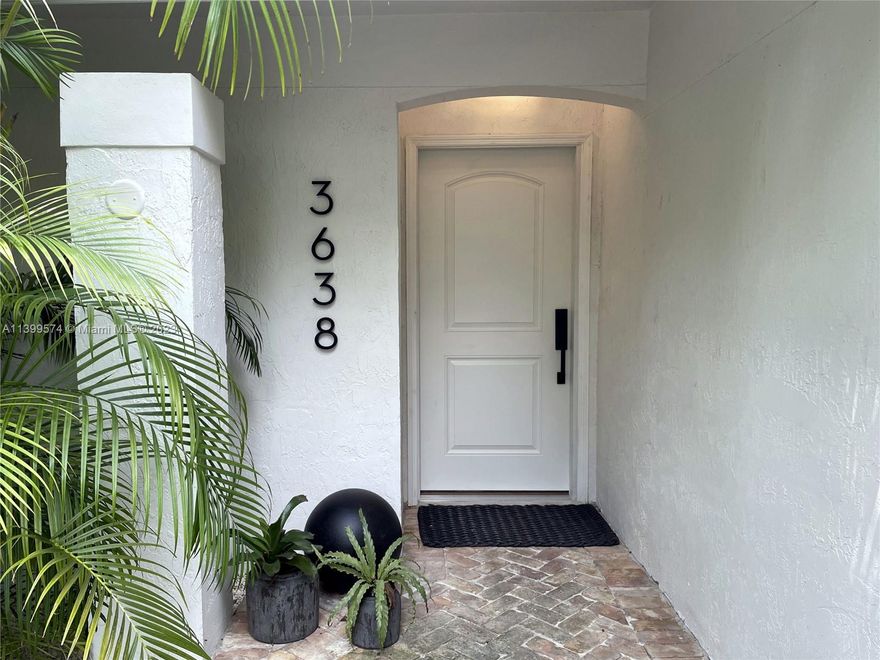 This delightful South Coconut Grove home features an open floor plan with lots of natural light, a cathedral ceiling & beautiful views of the pool & lush Grove landscape. The updated kitchen is stunning; the mood is serene and Zen.  Its' large primary suite boasts a nice-sized walk-in closet and bath. With 2 other bedrooms, an office/gym and a library/sun room, there is plenty of space for the entire family. And the location is ideal, on a quiet street, less than  a 12 minute walk to the Grove's restaurants & social center; or less for your kids that may go to Ransom, Carrolton or Carver.  We've got impact glass throughout... we're high on a ridge (not in a flood zone)... a 2-car carport & multiple updates, features and more.  Pool & yard maintenance is included.  You'll love living here.