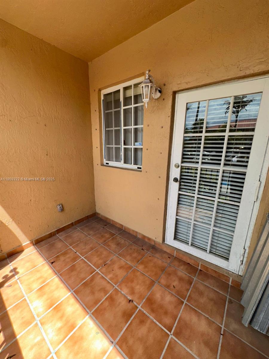 Spacious 3-bed, 2-bath corner unit in Poinciana Lakes Villas! This first-floor condo features tile floors throughout, an open living/dining area, and a private balcony perfect for relaxing. The kitchen offers ample cabinet space and a smart layout. Bedrooms are generously sized, with a primary suite that includes a walk-in closet and private bath. Includes two assigned parking spaces plus guest parking. Enjoy a well-maintained community close to schools, shopping, dining, highways, and parks. Low HOA fees and strong rental potential make this a great choice for first-time buyers or investors. Schedule your showing today via ShowingTime on MLS—don’t miss out!