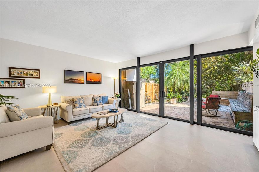 Welcome to this beautifully renovated, private townhouse in the highly sought-after gated community of Lake Ridge in Miami. Nestled within a lush, natural setting, this exceptional residence offers the perfect blend of tranquility and convenience. The home features a stunning white kitchen with new appliances, complimented by elegant porcelain floors throughout. A spacious living room opens seamlessly to a private, tree-lined patio with lush landscaping—ideal for indoor-outdoor living and entertaining. The ground floor also includes a bedroom and full bath, perfect for guests or flexible use. Upstairs, the expansive primary suite impresses with vaulted ceilings, a large walk-in closet, and a beautifully appointed bathroom featuring a generous walk-in shower. An additional upstairs bedroom offers its own ensuite bath, ample closet space, and a spacious layout. Lake Ridge is known for its serene, nature-filled environment, complete with a clean, usable lake, kayaking, tennis, and a waterfront pool. Enjoy peaceful strolls along the water while being just minutes from Coral Gables, the University of Miami, and a wide array of shopping, dining, and entertainment. A rare opportunity to enjoy refined living in one of Miami’s most desirable communities.