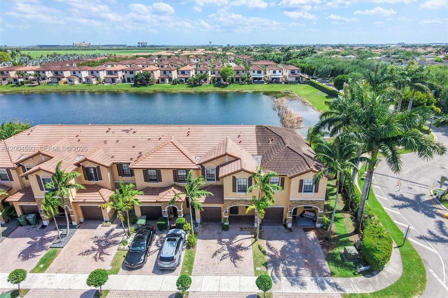 Enjoy peaceful lake views and added privacy with no rear neighbors in this Umbria at the Vineyards townhouse. Offering 1,628 sqft, the home features tile flooring downstairs and wood laminate upstairs. The kitchen includes ample counter space and an oversized pantry, along with a new A/C and new washer and dryer. The property also features a 1-car garage for added convenience. Relax in your private fenced backyard with pavers. Residents enjoy access to a clubhouse, pool, and playground.