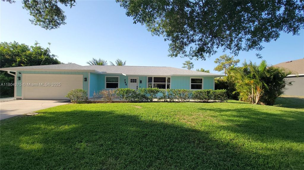 Photo of 744 Lake Dr, Sebastian, FL 32958 (MLS # A11804275)