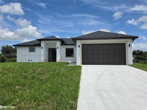 Photo of 2106 W 17th St, Lehigh Acres, FL 33972 (MLS # A12071791)