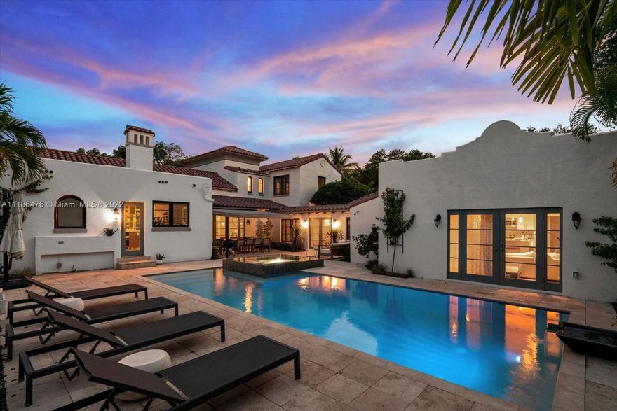 One of a Kind, Spectacular Mediterranean Estate situated on an expansive 19,200 SF corner parcel inclusive of towering oaks, a spacious main house+attached guest house. Main residence w/an impressive grand living/dining room, 6bds,5 full baths &2 halves.  Custom details throughout such as the 14th pecky cypress ceiling, ironwork, French Doors & remote fireplace. Window-lined poolside loggia leads to renovated guest house w/separate kitchen, laundry, living/dining, office & 2nd master. Walled grounds w/cover terrace, porte-cochere, full impact glass, heated saltwater pool w/built-in infinity jacuzzi & full house generator. Includes plans for a detached 2 garage.
A true masterpiece!!