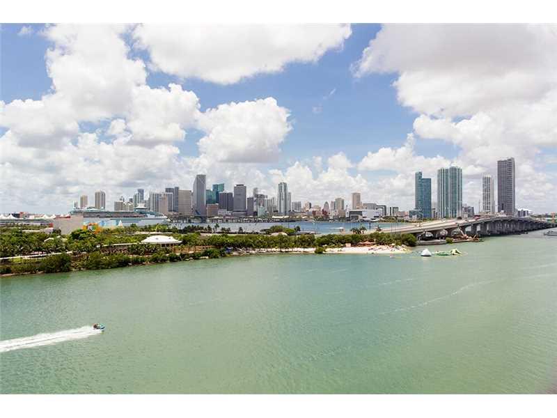 Designer Showcase surrounded by spectacular, panoramic views of Biscayne Bay & the Miami Skyline. Units 904 & 902 have been seamlessly combined into a spectacular full floor unit with a penthouse feel. This 3bed/3.5bath (4093 sq/ft per appraiser) was gut renovated with great attention to detail. Solid teak flooring along with the 9.5" walls of hurricane resistant glass, overlooking Biscayne Bay give the feeling of living on a luxury yacht. 3 assigned parking spaces. Please see virtual tour.
